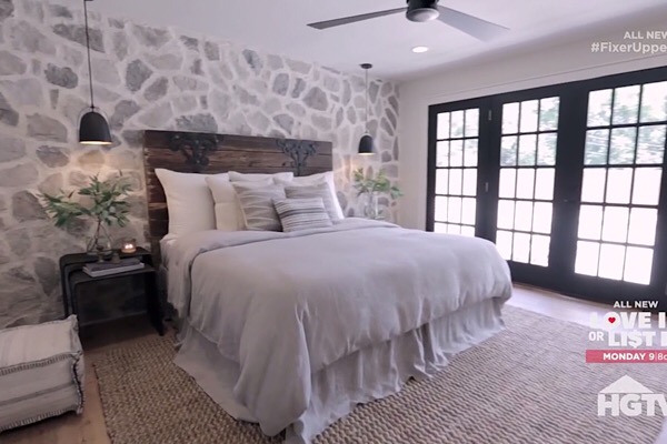 Master Bedroom with Stone Wall and Antique Headboard